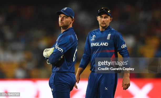 Jos Buttler and Joe Root of England look on during the ICC Men's Cricket World Cup India 2023 between England and Sri Lanka at M. Chinnaswamy Stadium...