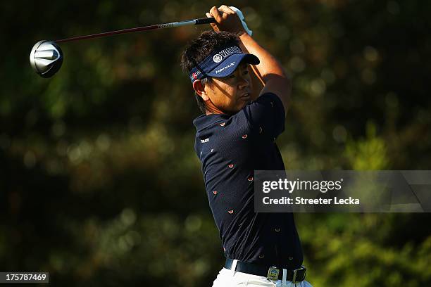 Hiroyuki Fujita of Japan watches a tee shot during the first round of the 95th PGA Championship on August 8, 2013 in Rochester, New York.