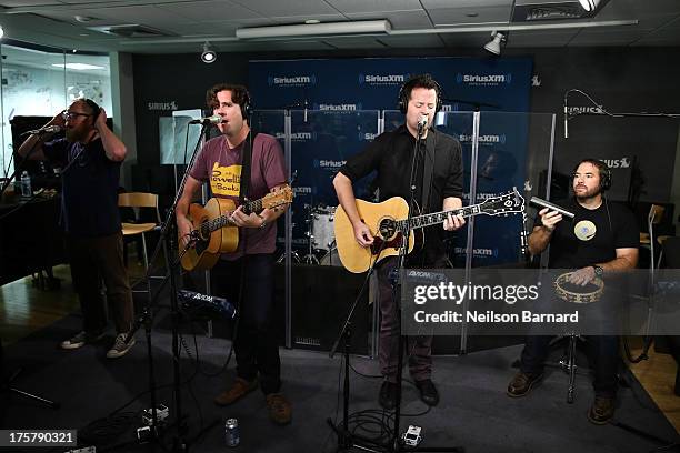 Musicians Jim Adkins, Rick Burch and Zach Lind of the band Jimmy Eat World visit SiriusXM Studios on August 8, 2013 in New York City.