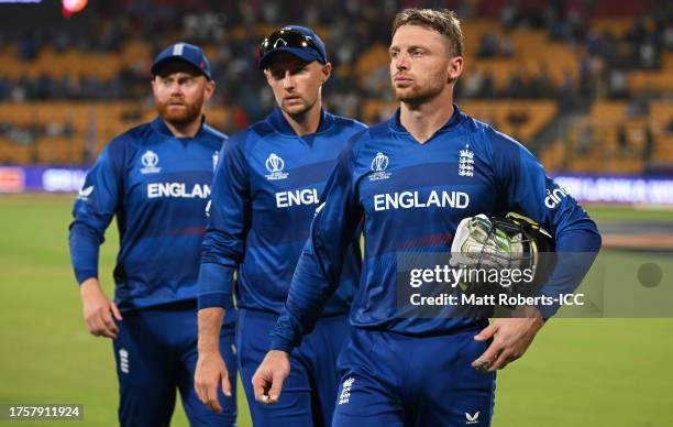 Jonny Bairstow, Jos Buttler and Joe Root of England cut dejected figures following the ICC Men's Cricket World Cup India 2023 between England and Sri...