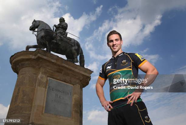 George North of Northampton Saints poses in front of a statue of King George I at the photocall held at Stowe School on August 8, 2013 in Stowe,...