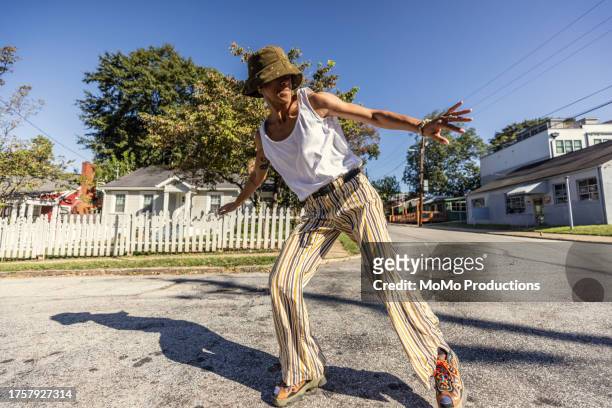 female breakdancer performing in urban environment - live georgia show stock pictures, royalty-free photos & images