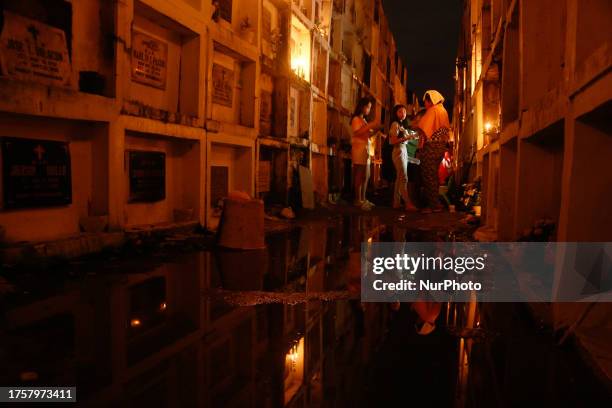 People visit the grave of their loved ones in Antipolo City, Philippines on November 1, 2023. All Soul's Day, locally known as Araw Ng Mga Patay or...