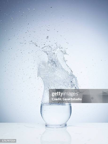 high speed image of water exploding on the vase - slow motion water stock pictures, royalty-free photos & images