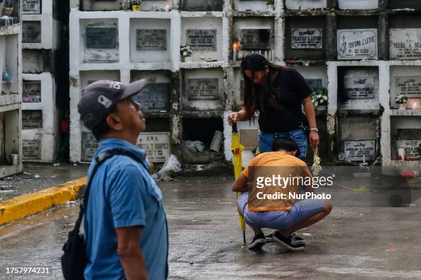 People visit the grave of their loved ones in Antipolo City, Philippines on November 1, 2023. All Soul's Day, locally known as Araw Ng Mga Patay or...