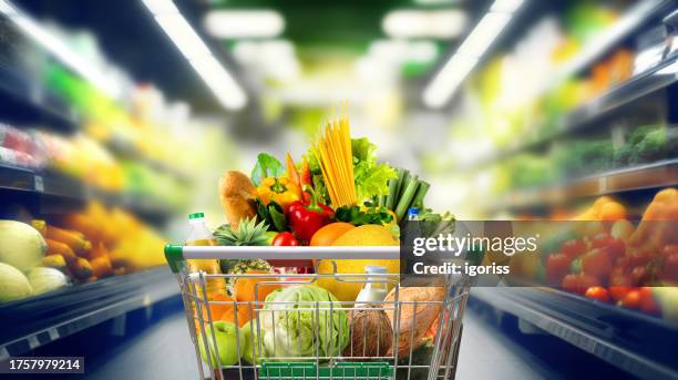 Shopping cart full of groceries at the supermarket.
