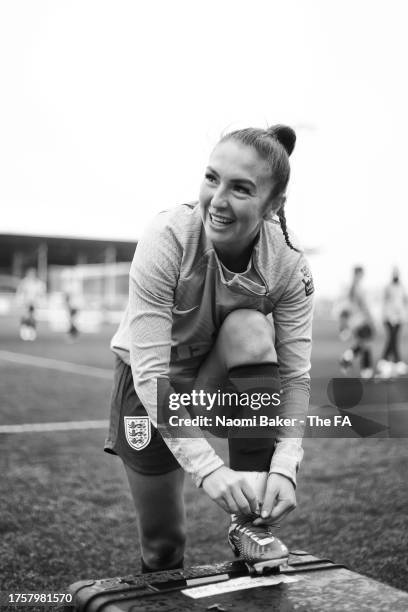 Katie Zelem of England ties up her laces on her football boots at St George's Park on October 26, 2023 in Burton upon Trent, England.