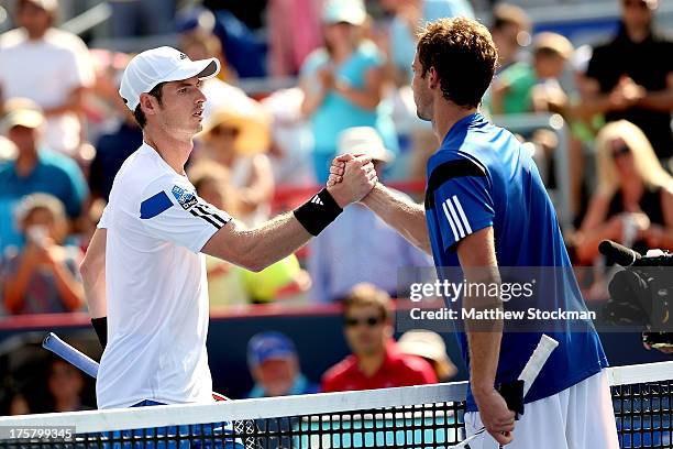 Andy Murray of Great Britain congratulates Ernests Gulbis of Latvia after their match during the Rogers Cup at Uniprix Stadium on August 8, 2013 in...