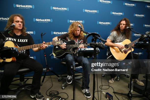 David Ellefson, Dave Mustaine, Chris Broderick and Shawn Drover of Megadeth perform at SiriusXM Studios on August 8, 2013 in New York City.