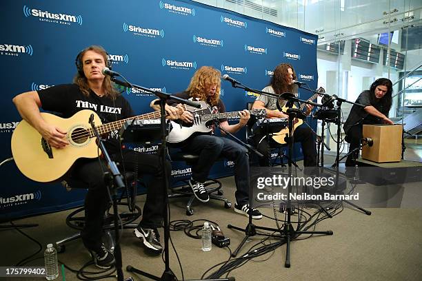 David Ellefson, Dave Mustaine, Chris Broderick and Shawn Drover of Megadeth perform at SiriusXM Studios on August 8, 2013 in New York City.