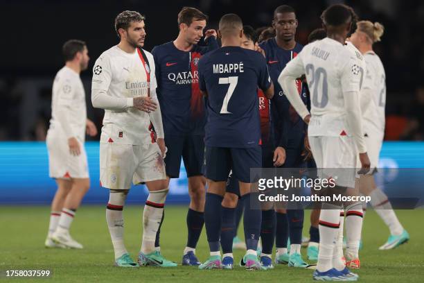 Players from both teams salute each other following the final whistle of the UEFA Champions League match between Paris Saint-Germain and AC Milan at...
