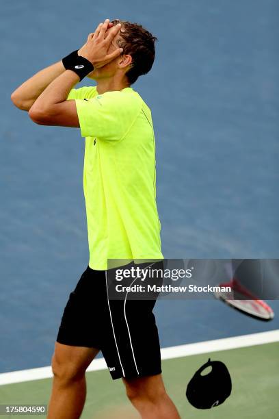 Vasek Pospisil of Canada celebrates match point against Tomas Berdych of Czech Republic during the Rogers Cup at Uniprix Stadium on August 8, 2013 in...