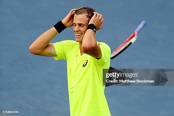 Vasek Pospisil of Canada celebrates match point against Tomas Berdych of Czech Republic during the Rogers Cup at Uniprix Stadium on August 8, 2013 in...
