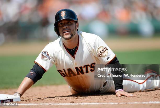 Gregor Blanco of the San Francisco Giants reacts after he was doubled off of first base on a failed sacrifice bunt attempt from Tim Lincecum in the...