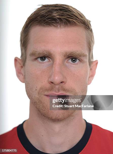 Per Mertesacker of Arsenal poses during the first team photocall at Emirates Stadium on August 08, 2013 in London, England.
