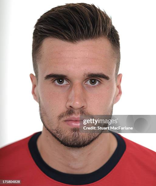 Carl Jenkinson of Arsenal poses during the first team photocall at Emirates Stadium on August 08, 2013 in London, England.