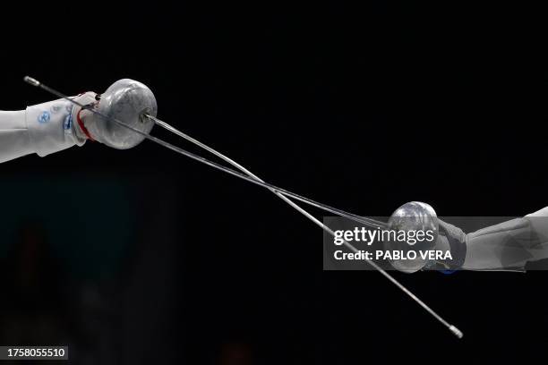 Chile's Analia Fernandez and Argentina's Clara Di Tella compete during the women's epee individual semifinals bronze medal bout fencing event of the...