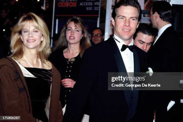 Actress Meg Ryan and her husband actor Dennis Quaid attend the premiere of 'When Harry Met Sally' on December 2, 1989 in London, England.
