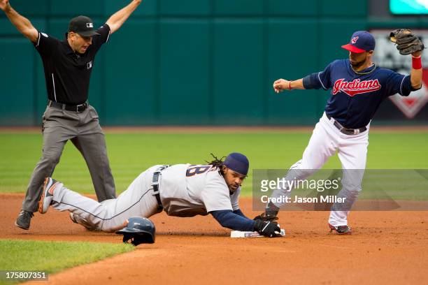Second base umpire Phil Cuzzi calls Prince Fielder of the Detroit Tigers safe at second on a hit to right as second baseman Mike Aviles of the...
