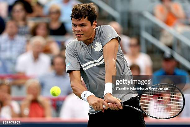 Milos Raonic of Canada returns a shot to Juan Martin Del Potro of Argentina during the Rogers Cup at Uniprix Stadium on August 8, 2013 in Montreal,...