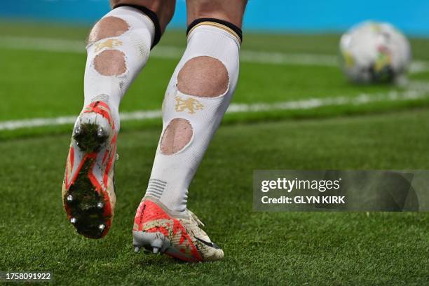 Chelsea's English midfielder Conor Gallagher wears socks with holes during the English League Cup fourth round football match between Chelsea and...