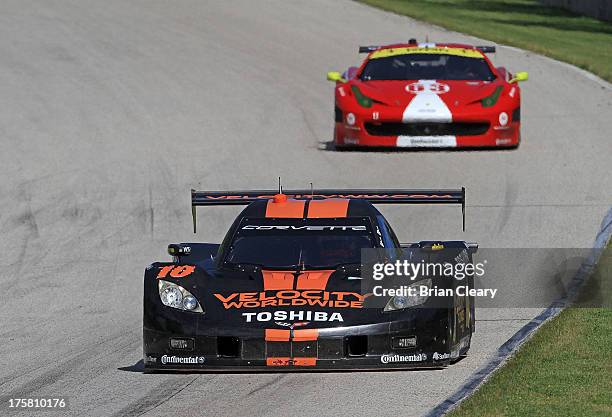 The Corvette DP of Jordan Taylor and Max Angelelli races down a hill during practice at Road America on August 8, 2013 in Elkhart Lake, Wisconsin.
