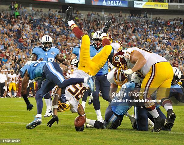 Wide receiver Leonard Hankerson of the Washington Redskins dives into the end zone to score a touchdown against the Tennessee Titans during a...