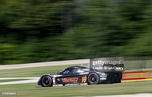 The Corvette DP of Jordan Taylor and Max Angelelli races down a hill during practice at Road America on August 8, 2013 in Elkhart Lake, Wisconsin.