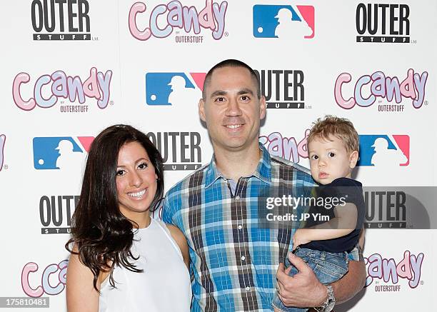 New York Yankee Travis Hafner, his wife Amy Hafner and their son attend the CCandy Children's Clothing Line Launch at MLB Fan Cave on August 8, 2013...