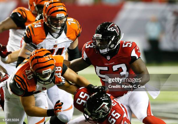 Brian Banks of the Atlanta Falcons runs the defense against the Cincinnati Bengals in the fourth quarter at Georgia Dome on August 8, 2013 in...