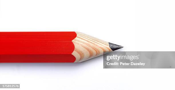 red pencil with copy space - pencil stockfoto's en -beelden