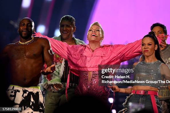 Pink Performance Recently Pink performs with her dancers and members of her band at Ball Arena ...