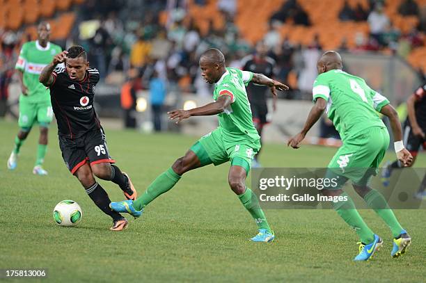 Kermit Erasmus of Pirates, Letladi Madubanya and Msekeli Mvalo of Amazulu compete during the Absa Premiership match between Orlando Pirates and...