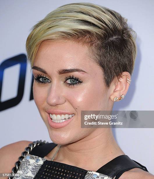 Miley Cyrus arrives at the "Paranoia" - Los Angeles Premiere at DGA Theater on August 8, 2013 in Los Angeles, California.