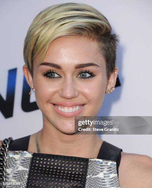 Miley Cyrus arrives at the "Paranoia" - Los Angeles Premiere at DGA Theater on August 8, 2013 in Los Angeles, California.