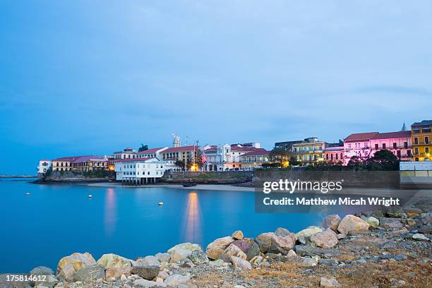 colonial buildings line casco viejo's waterfront - panama city fotografías e imágenes de stock