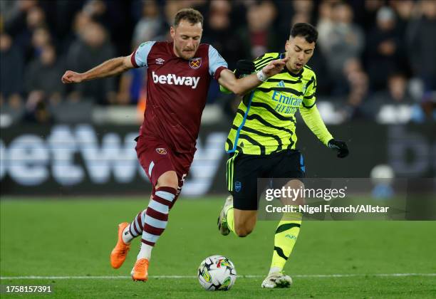 Vladimír Coufal of West Ham United and Gabriel Martinelli of Arsenal challenge during the Carabao Cup Fourth Round match between West Ham United and...