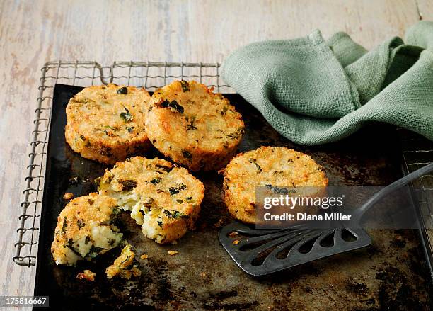 bubble and squeak cakes on baking sheet with wire rack - bubble and squeak stock pictures, royalty-free photos & images
