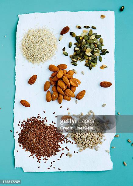 flax seeds, pumpkin seeds, sunflower seeds and almonds - pumpkin seed stock pictures, royalty-free photos & images