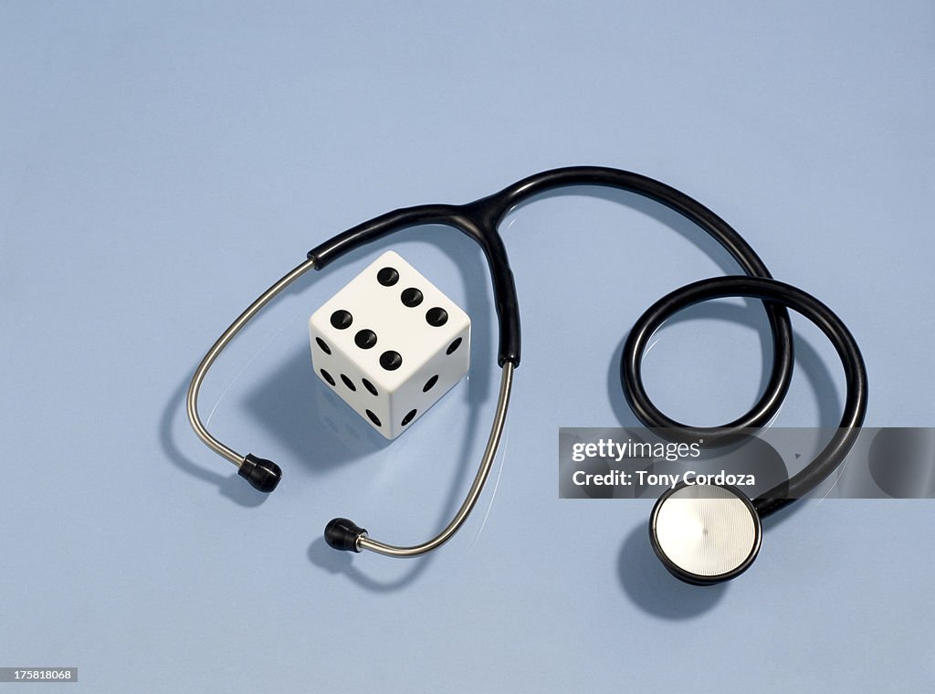 Stethoscope and dice