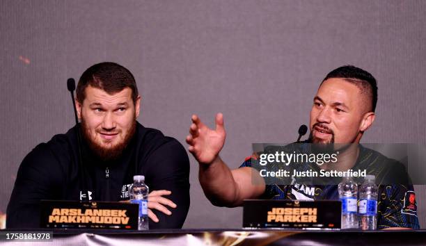 Arslanbek Makhmudov and Joseph Parker react during a press conference ahead of the Tyson Fury v Francis Ngannou boxing match at Boulevard Hall on...