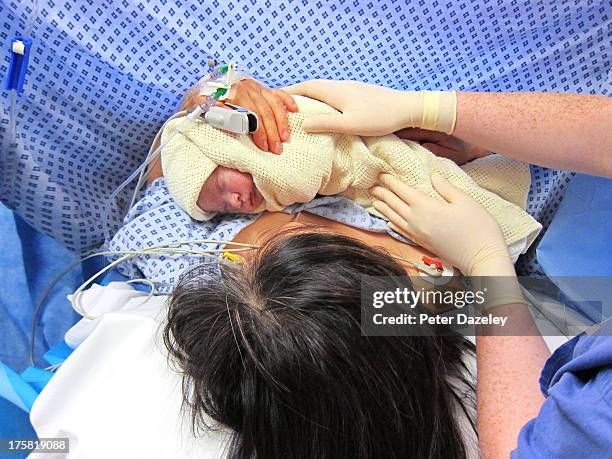 mother with newborn baby - labour childbirth stock pictures, royalty-free photos & images