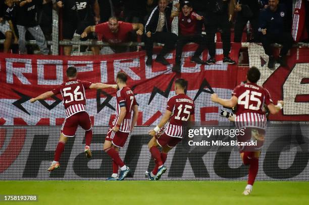 Kostas Fortounis of Olympiakos celebrates with teammates after scoring the team's first goal during the UEFA Europa League 2023/24 match between...