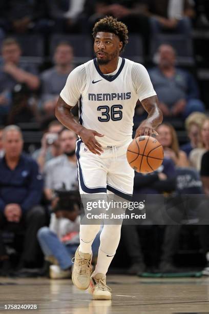 Marcus Smart of the Memphis Grizzlies brings the ball up court during the game against the New Orleans Pelicans at FedExForum on October 25, 2023 in...