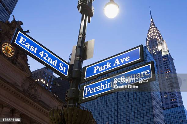 pershing square and park avenue street signs at dusk, new york city, usa - park avenue stock pictures, royalty-free photos & images