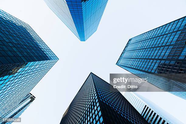 low angled view of skyscrapers - repetition office stock pictures, royalty-free photos & images