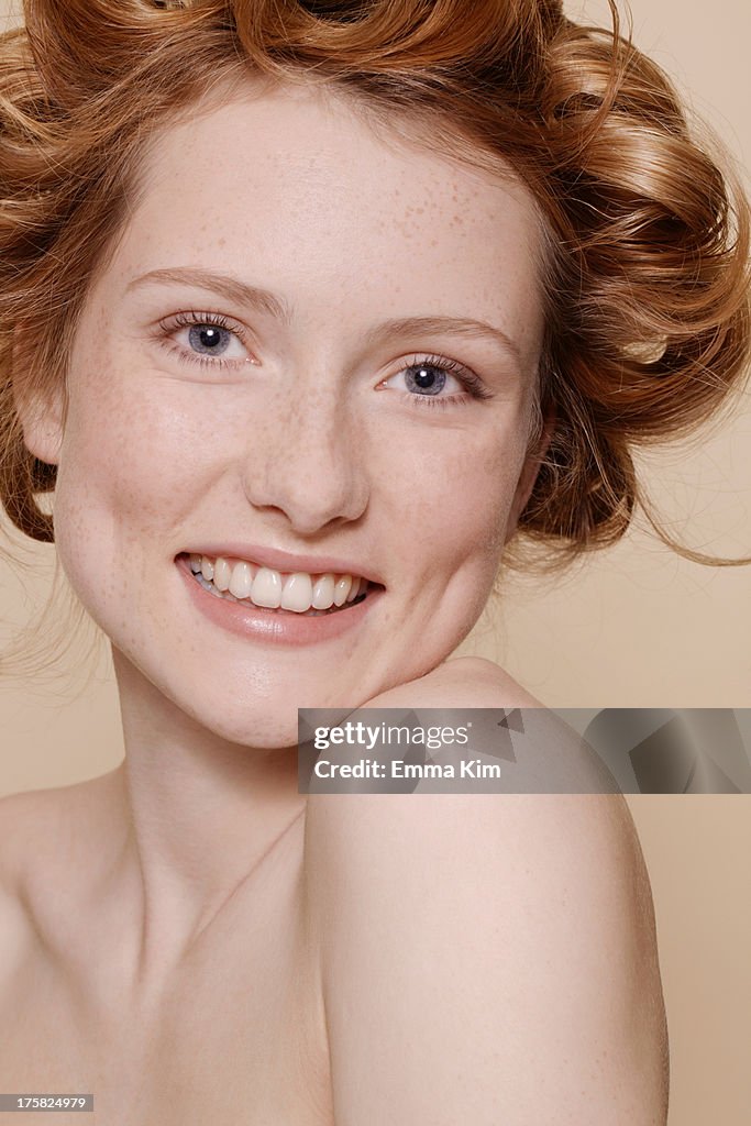 Young woman with curly red hair, portrait