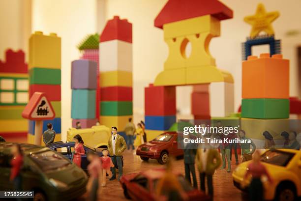 toy cars and figurines in pretend plastic block town - small town imagens e fotografias de stock