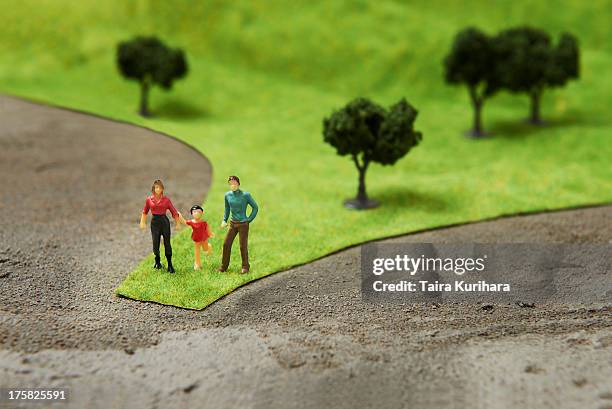 figurines on pretend grass with trees - small changes stock pictures, royalty-free photos & images