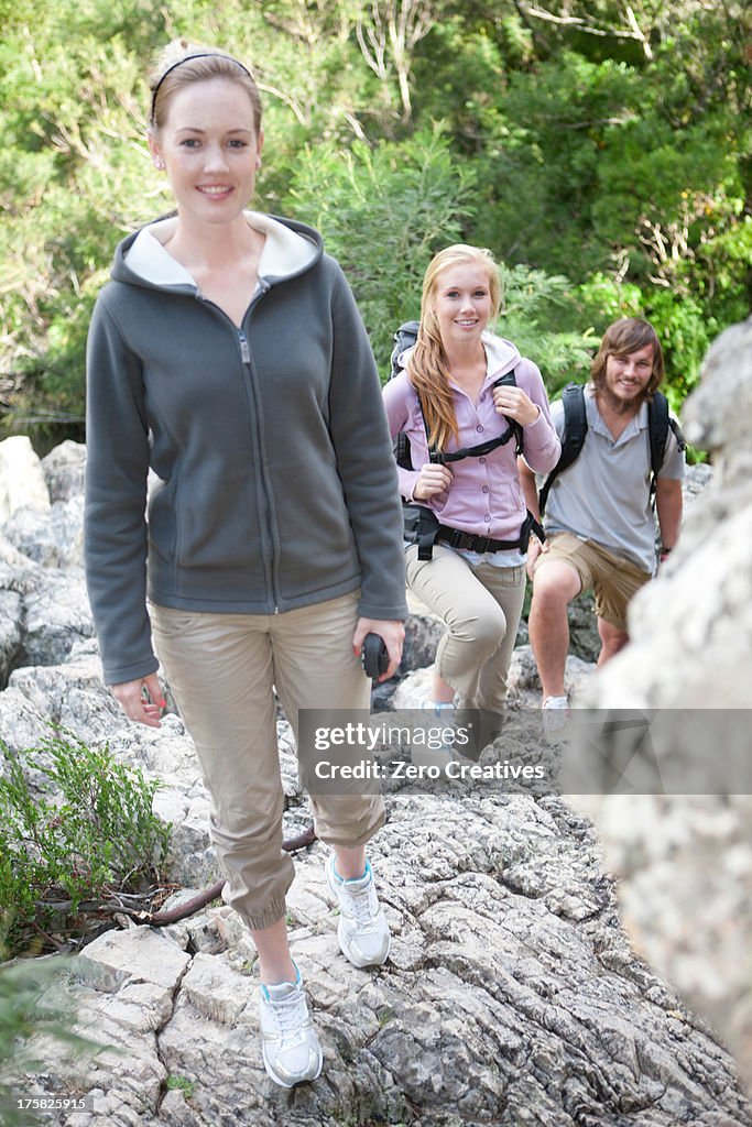 Portrait of young hikers on rock